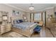 Serene main bedroom featuring a bay window, chandelier, and elegant furnishings at 4738 Ivy Ridge Se Dr, Atlanta, GA 30339