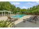 Community pool with lounge chairs, privacy fence, and plenty of space to relax at 4738 Ivy Ridge Se Dr, Atlanta, GA 30339