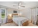 Bright bedroom with wood bed frame and neutral decor at 51 Jennifer Ln, Rydal, GA 30171