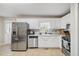 Kitchen with stainless steel appliances and white cabinets at 51 Jennifer Ln, Rydal, GA 30171