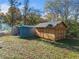 Two storage sheds, one metal and one wood, in the backyard at 51 Jennifer Ln, Rydal, GA 30171