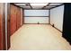 Unfinished basement space with carpeted floor at 8441 Lake Dr, Snellville, GA 30039