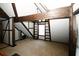 Large bonus room with built-in shelving and hardwood floors at 8441 Lake Dr, Snellville, GA 30039