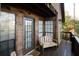 Wooden deck with seating and view of surrounding trees at 8441 Lake Dr, Snellville, GA 30039