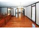 Hardwood floors, chandelier, and open to kitchen at 8441 Lake Dr, Snellville, GA 30039
