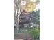 A-frame home nestled in woods with wrap-around deck at 8441 Lake Dr, Snellville, GA 30039