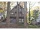 Rustic A-frame home with large deck and trees at 8441 Lake Dr, Snellville, GA 30039