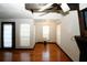Spacious living room with hardwood floors and large windows at 8441 Lake Dr, Snellville, GA 30039