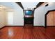 Living room with hardwood floors and a built-in entertainment center at 8441 Lake Dr, Snellville, GA 30039