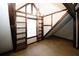 Cozy loft bedroom with built-in shelves and a large window at 8441 Lake Dr, Snellville, GA 30039