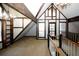 Spacious loft area with built-in shelving and a view to the floor below at 8441 Lake Dr, Snellville, GA 30039