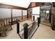 Upstairs hallway loft area with a rocking chair and view of another room at 8441 Lake Dr, Snellville, GA 30039