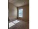 Bright bedroom with carpet and large window at 1212 Lake Point Way, Suwanee, GA 30024