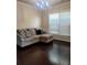 Living room with hardwood floors and neutral-toned furniture at 1212 Lake Point Way, Suwanee, GA 30024