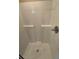 Clean shower with white walls and chrome fixtures at 1212 Lake Point Way, Suwanee, GA 30024