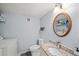 Well-lit bathroom featuring granite countertops, a decorative mirror, and a modern toilet and sink at 2946 N Dekalb Dr # Apt C, Atlanta, GA 30340