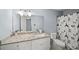 Well-lit bathroom featuring granite countertops, a modern vanity, and an Eiffel Tower shower curtain at 2946 N Dekalb Dr # Apt C, Atlanta, GA 30340