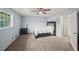 Spacious bedroom with a ceiling fan, plush carpet, and a large window for natural light at 2946 N Dekalb Dr # Apt C, Atlanta, GA 30340