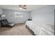 Cozy bedroom featuring a ceiling fan, large window, and a comfortable lounge chair at 2946 N Dekalb Dr # Apt C, Atlanta, GA 30340