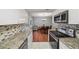 Well-designed kitchen with granite countertops, stainless steel appliances, and an open view to the dining area at 2946 N Dekalb Dr # Apt C, Atlanta, GA 30340