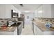 Modern kitchen with white cabinets, granite countertops, stainless steel appliances, and stylish backsplash at 2946 N Dekalb Dr # Apt C, Atlanta, GA 30340