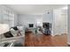 Cozy living room with modern furnishings, hardwood floors, and plenty of natural light from a large window at 2946 N Dekalb Dr # Apt C, Atlanta, GA 30340