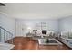 Bright living room showcasing hardwood floors, contemporary decor, a stairway, and ample seating at 2946 N Dekalb Dr # Apt C, Atlanta, GA 30340