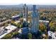 An aerial view of a high-rise community with landscaping, trees, and parking at 2870 Pharr Court South Nw # 2602, Atlanta, GA 30305