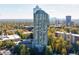 Aerial view of The Concorde building surrounded by lush greenery and cityscape at 2870 Pharr Court South Nw # 2602, Atlanta, GA 30305