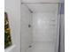 Bathroom shower featuring stylish white marble-patterned tile at 2870 Pharr Court South Nw # 2602, Atlanta, GA 30305