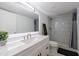 Well-lit bathroom with a spacious vanity and a tiled shower at 2870 Pharr Court South Nw # 2602, Atlanta, GA 30305