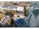Aerial view through the window showcases an outdoor tennis court, parking lot, and nearby buildings at 2870 Pharr Court South Nw # 2602, Atlanta, GA 30305