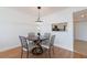 Cozy dining area with table for four, adjacent to kitchen, illuminated by a modern pendant light at 2870 Pharr Court South Nw # 2602, Atlanta, GA 30305