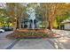 The Concorde building's exterior, showcasing landscaped entry with trees and a fountain at 2870 Pharr Court South Nw # 2602, Atlanta, GA 30305