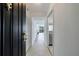 Inviting hallway view leads to bright living space with scenic views through expansive windows at 2870 Pharr Court South Nw # 2602, Atlanta, GA 30305
