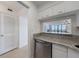 Kitchen bar open to the living room offers convenience and connection to social space at 2870 Pharr Court South Nw # 2602, Atlanta, GA 30305