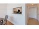 Kitchenette with granite countertop pass-through to an open living and dining area at 2870 Pharr Court South Nw # 2602, Atlanta, GA 30305