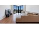 Bright living room featuring hardwood floors, large windows with city views, and a comfortable sectional couch at 2870 Pharr Court South Nw # 2602, Atlanta, GA 30305