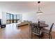 Open living space features hardwood floors, floor-to-ceiling windows with expansive city views at 2870 Pharr Court South Nw # 2602, Atlanta, GA 30305