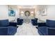 Comfortable lobby features stylish blue chairs, marble floors, and elegant wall decor at 2870 Pharr Court South Nw # 2602, Atlanta, GA 30305