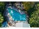 Aerial view of the community pool surrounded by trees and lounging areas at 2870 Pharr Court South Nw # 2602, Atlanta, GA 30305