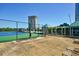 Community tennis court with green and blue surfaces, surrounded by trees at 2870 Pharr Court South Nw # 2602, Atlanta, GA 30305
