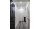 Bright entryway with dark door, gray flooring, and access to other rooms at 1280 W Peachtree Nw St # 914, Atlanta, GA 30309