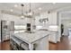 Modern kitchen with white cabinets and granite island at 3306 Main St, Duluth, GA 30096