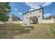 Spacious backyard with well-maintained lawn, patio area and white wooden fence at 207 Eagles Flight, Villa Rica, GA 30180