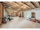 Unfinished basement showing exposed beams, concrete floor, and potential for customization at 207 Eagles Flight, Villa Rica, GA 30180