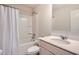 Clean bathroom with a shower-tub combo, single sink vanity, and mirrored cabinet at 207 Eagles Flight, Villa Rica, GA 30180