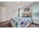 Cozy bedroom with neutral walls, carpet, and soft, natural light from a bright window at 207 Eagles Flight, Villa Rica, GA 30180