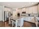 Modern kitchen featuring white cabinets, stainless steel appliances, granite countertops, and a center island at 207 Eagles Flight, Villa Rica, GA 30180