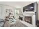 Cozy living room with fireplace, built-in bookshelves, and comfortable seating area at 207 Eagles Flight, Villa Rica, GA 30180